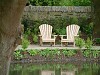 2 Classic Adirondack Chairs in an Oxfordshire garden